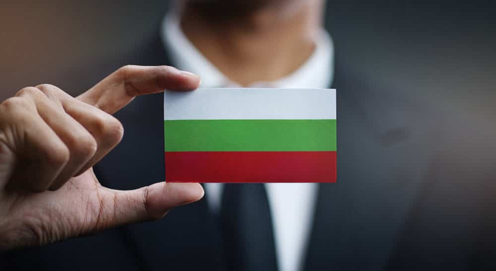 businessman holding a card after company registration in Bulgaria