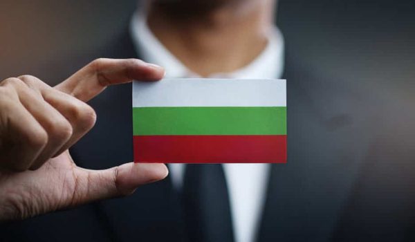 businessman holding a card after company registration in Bulgaria